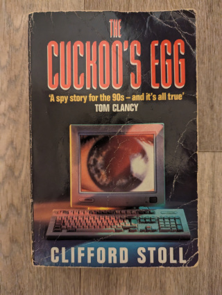 The front cover of The Cuckoo's Egg that shows much wear